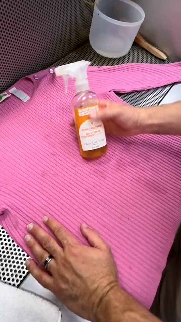 A pink knit being treated with Glenforest Reserve