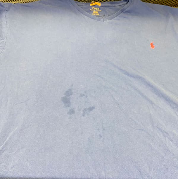 Blue V-neck shirt, before Glenforest's care